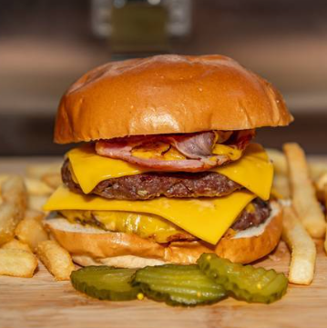 Double cheeseburger with ham, fries and pickles
