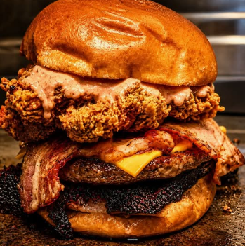 Fried chicken and bacon burger on a brioche bun