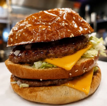 Double cheeseburger on a sesame bun